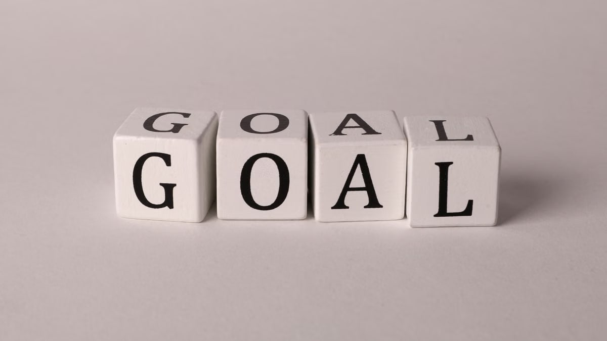 White letter blocks spelling 'Goal' on a neutral backdrop, ideal for business themes.